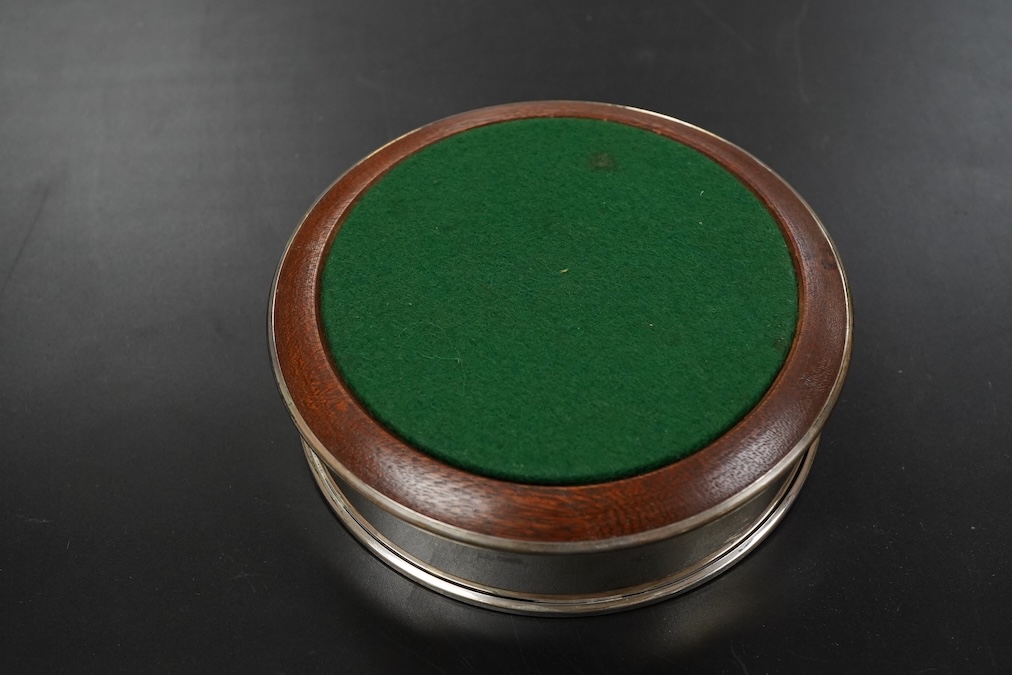 A pair of Elizabeth II silver bottle coasters diameter 13cm